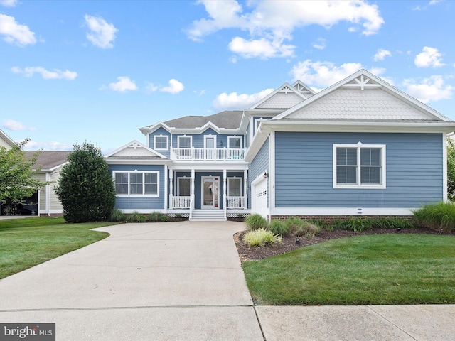 view of front of home featuring a balcony, a front lawn, covered porch, and a garage