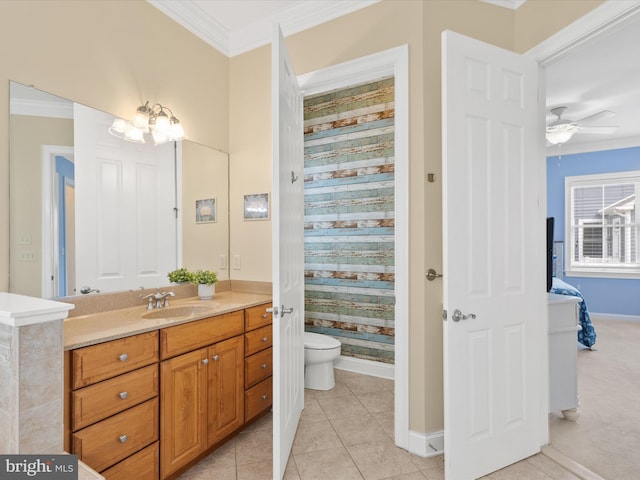 bathroom with vanity, tile patterned floors, ceiling fan, toilet, and ornamental molding