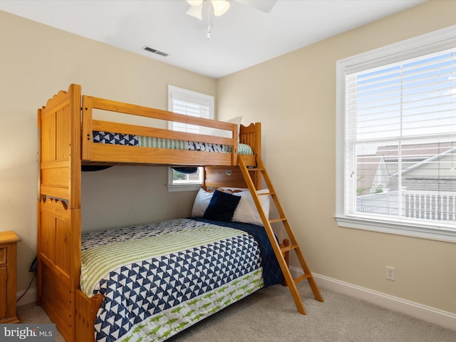 carpeted bedroom with ceiling fan