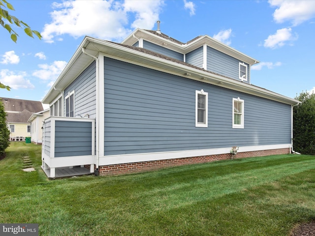 view of home's exterior featuring a lawn