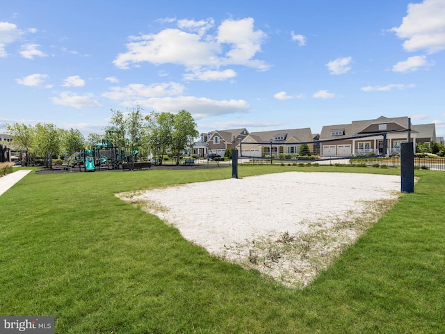 view of property's community with a playground, a yard, and volleyball court