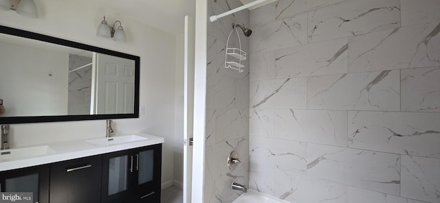 bathroom featuring vanity and tiled shower / bath combo