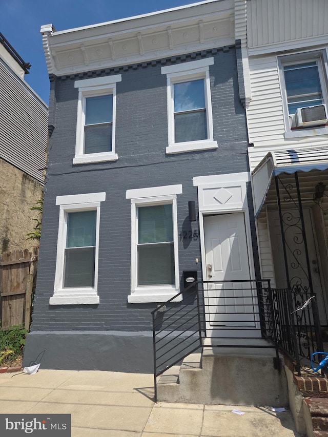 view of front of house featuring cooling unit