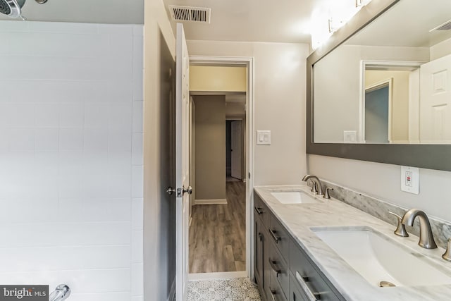 bathroom featuring hardwood / wood-style flooring and vanity