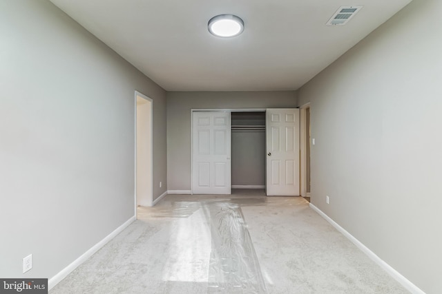 unfurnished bedroom with a closet