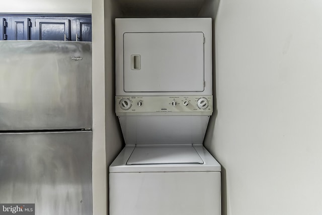 washroom with stacked washer and clothes dryer