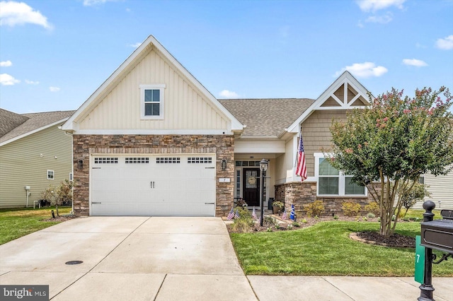 craftsman house featuring a garage and a front yard