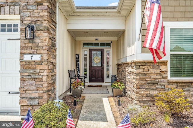 doorway to property featuring a garage