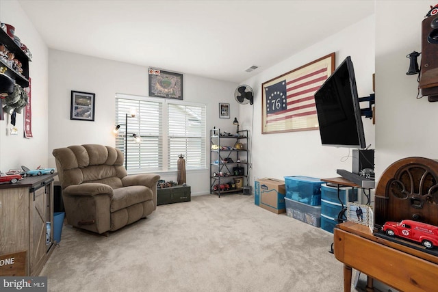 living area featuring light colored carpet