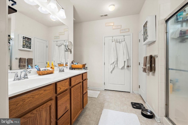 bathroom featuring vanity and walk in shower