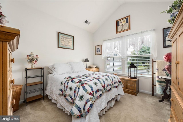 bedroom featuring light carpet and lofted ceiling