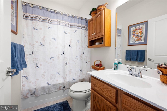 full bathroom featuring toilet, vanity, tile patterned floors, and shower / bath combination with curtain