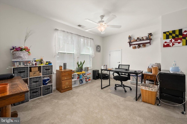 carpeted home office with ceiling fan