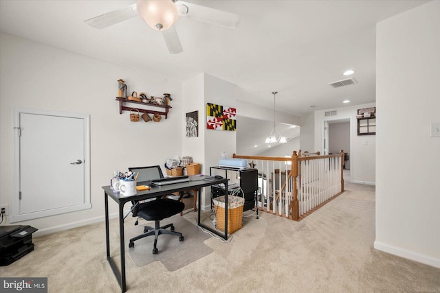 home office with ceiling fan and light carpet