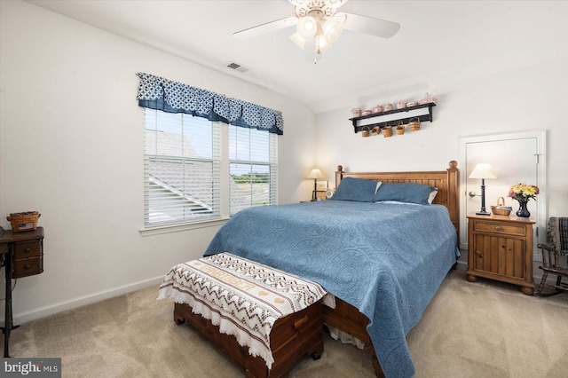 bedroom with ceiling fan and light colored carpet