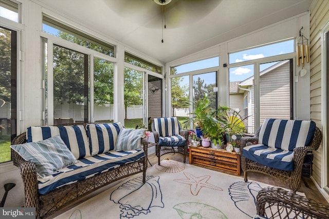 sunroom / solarium featuring ceiling fan and lofted ceiling