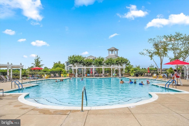 view of pool with a pergola and a patio