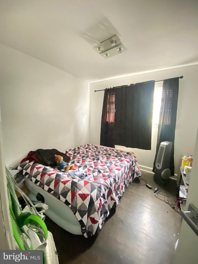 bedroom featuring concrete floors