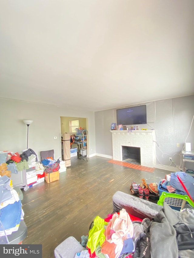 living room featuring a fireplace and hardwood / wood-style floors