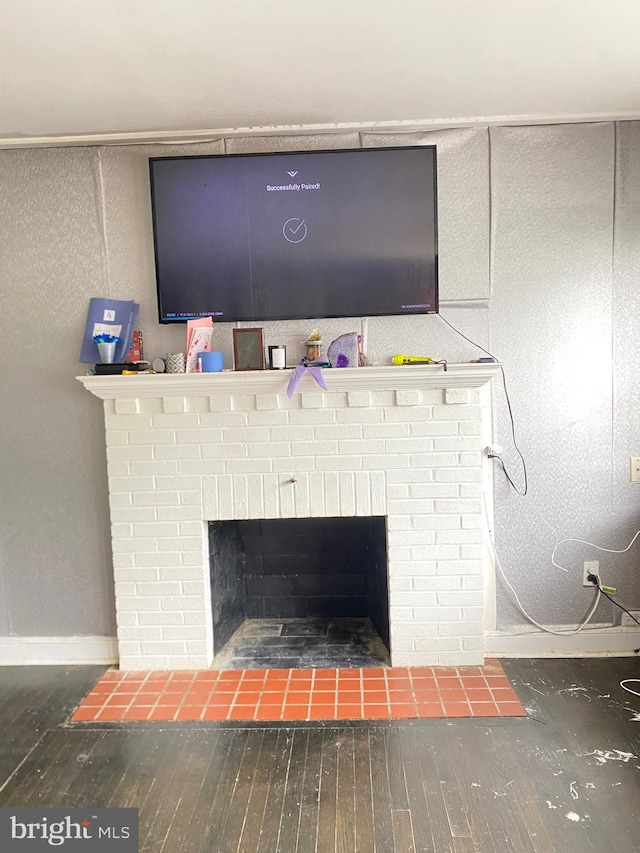 interior details featuring a fireplace and hardwood / wood-style floors