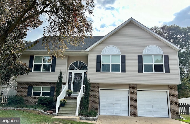 bi-level home featuring a garage