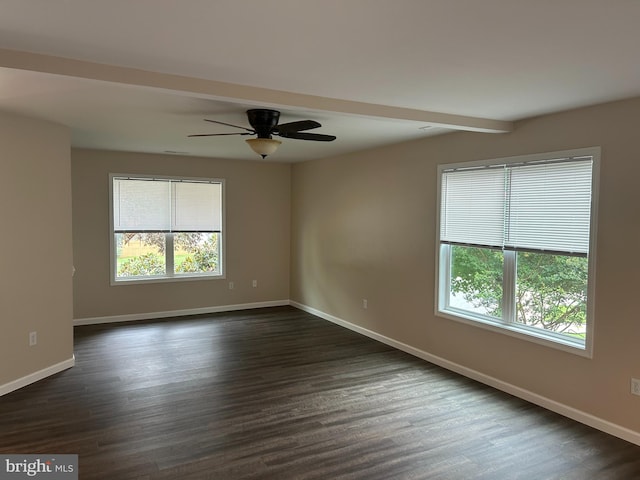 empty room featuring ceiling fan and dark hardwood / wood-style floors