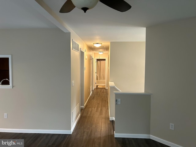 corridor featuring dark hardwood / wood-style floors