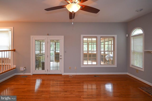 interior space with hardwood / wood-style floors and ceiling fan