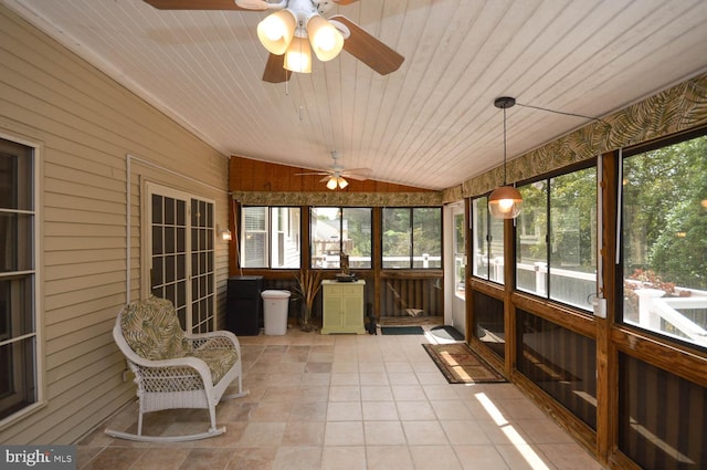 sunroom featuring wood ceiling, ceiling fan, and lofted ceiling