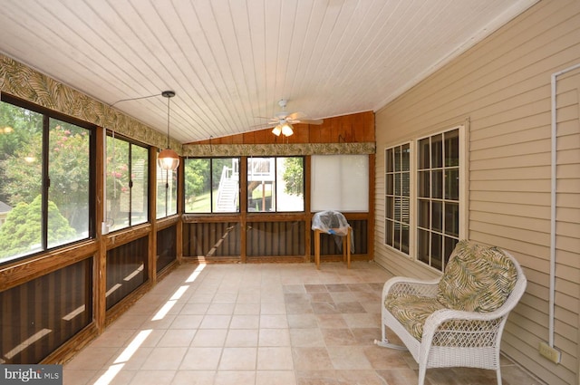 unfurnished sunroom featuring wood ceiling, ceiling fan, and lofted ceiling