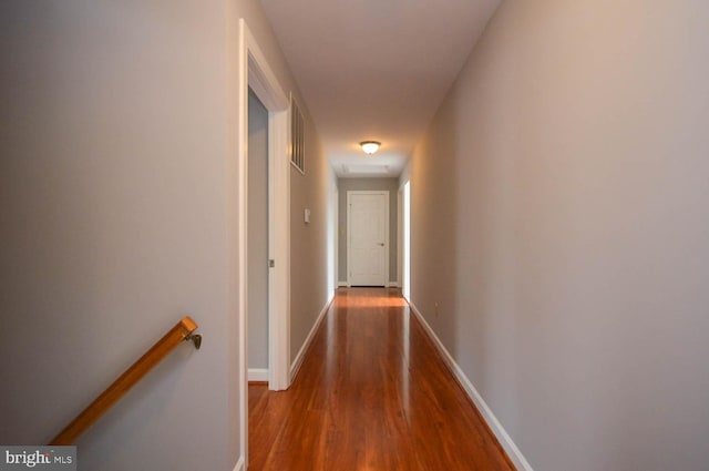 hallway featuring wood-type flooring