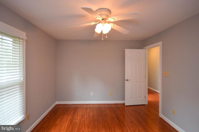 empty room with ceiling fan and wood-type flooring