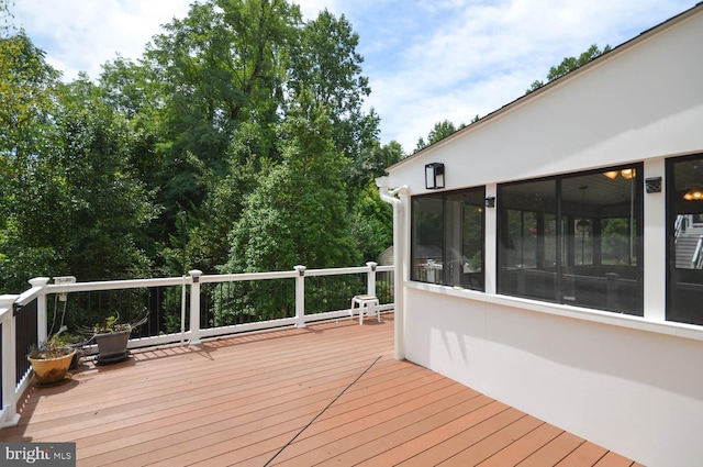 wooden terrace with a sunroom