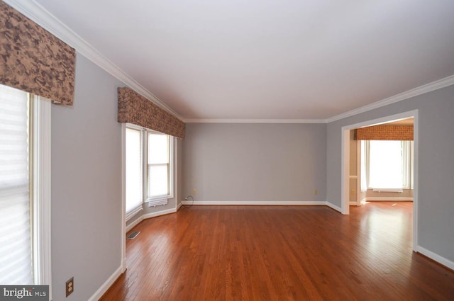 interior space featuring ornamental molding, hardwood / wood-style flooring, and plenty of natural light