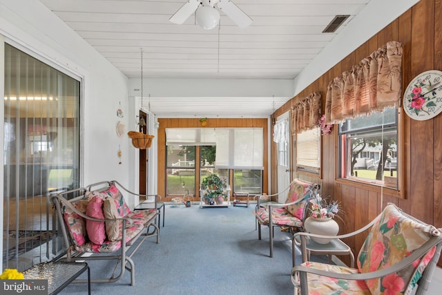 sunroom / solarium featuring ceiling fan