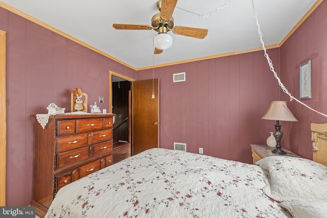 bedroom featuring ornamental molding and ceiling fan