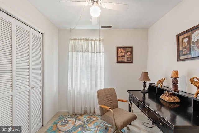 living area with ceiling fan