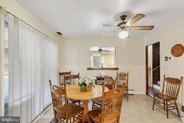 dining area featuring ceiling fan and a baseboard radiator