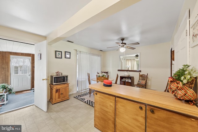 kitchen featuring ceiling fan