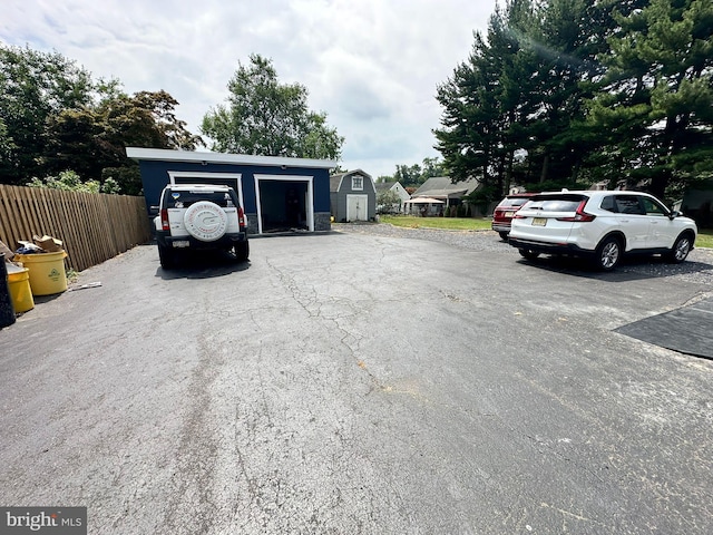 view of car parking with a garage