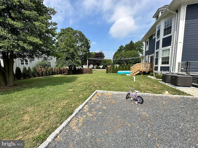 view of yard featuring central AC