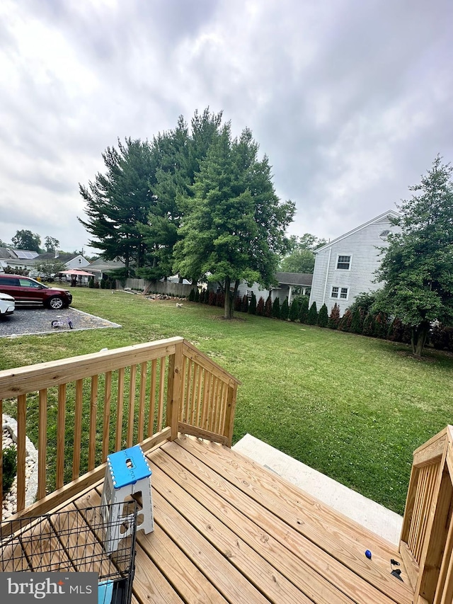 deck featuring a lawn