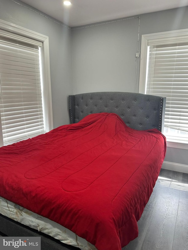 bedroom with wood-type flooring