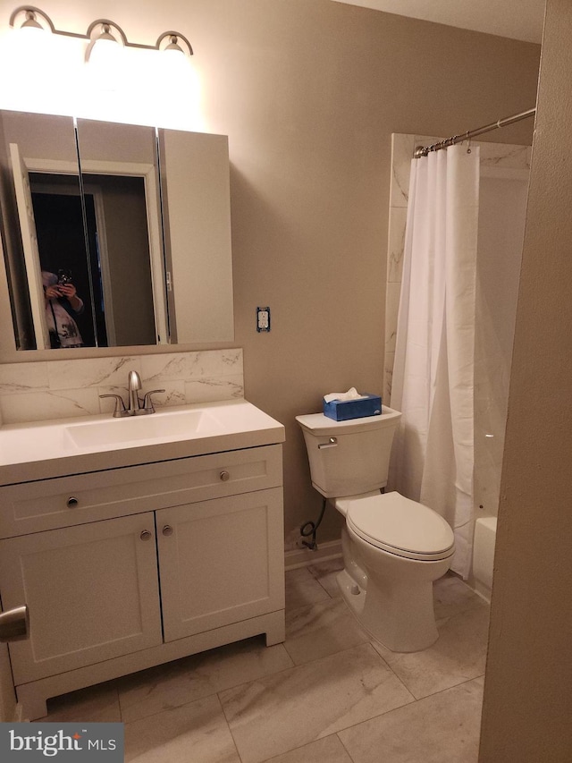 full bathroom featuring marble finish floor, tasteful backsplash, shower / bathtub combination with curtain, toilet, and vanity