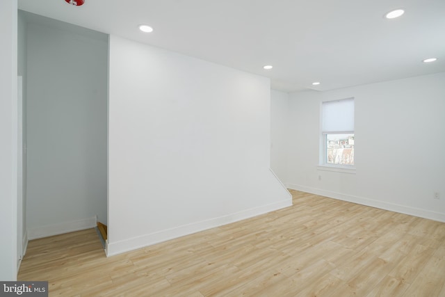 empty room with light hardwood / wood-style floors