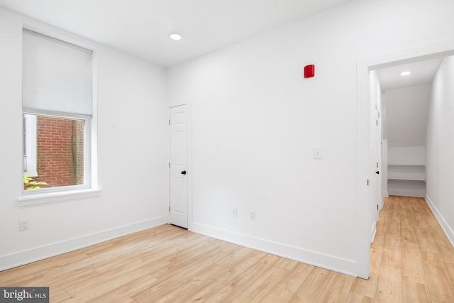 spare room featuring light hardwood / wood-style floors