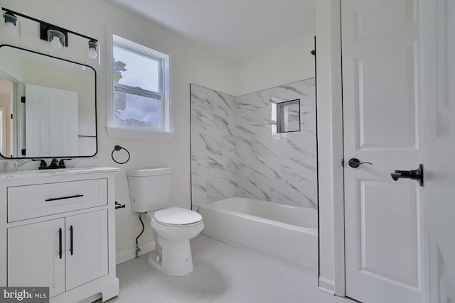 full bathroom with vanity, tiled shower / bath combo, and toilet