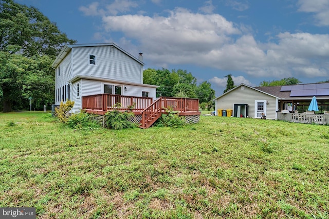 view of yard with a wooden deck