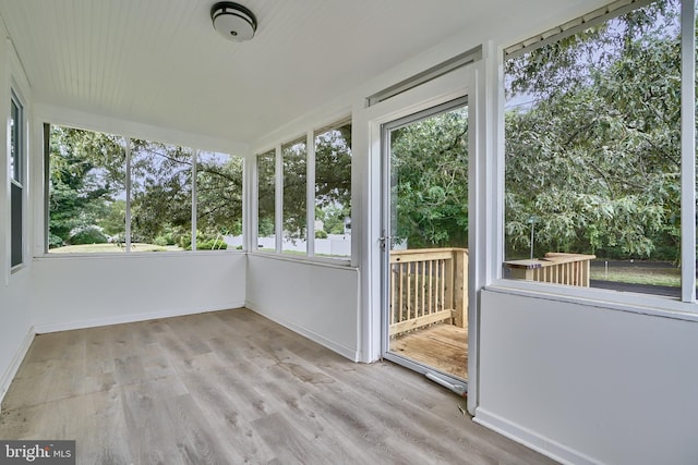 unfurnished sunroom featuring a wealth of natural light