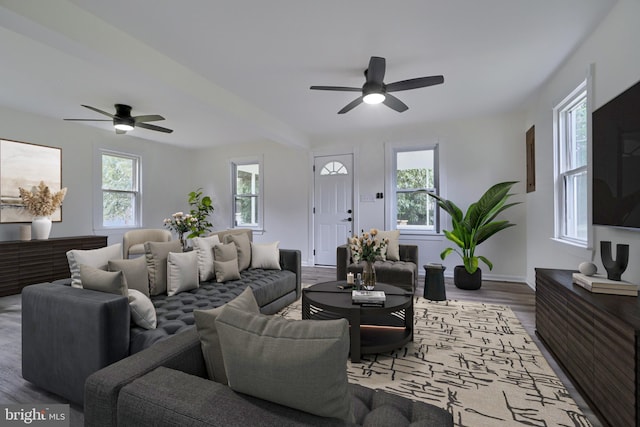 living room with hardwood / wood-style floors, a wealth of natural light, and ceiling fan